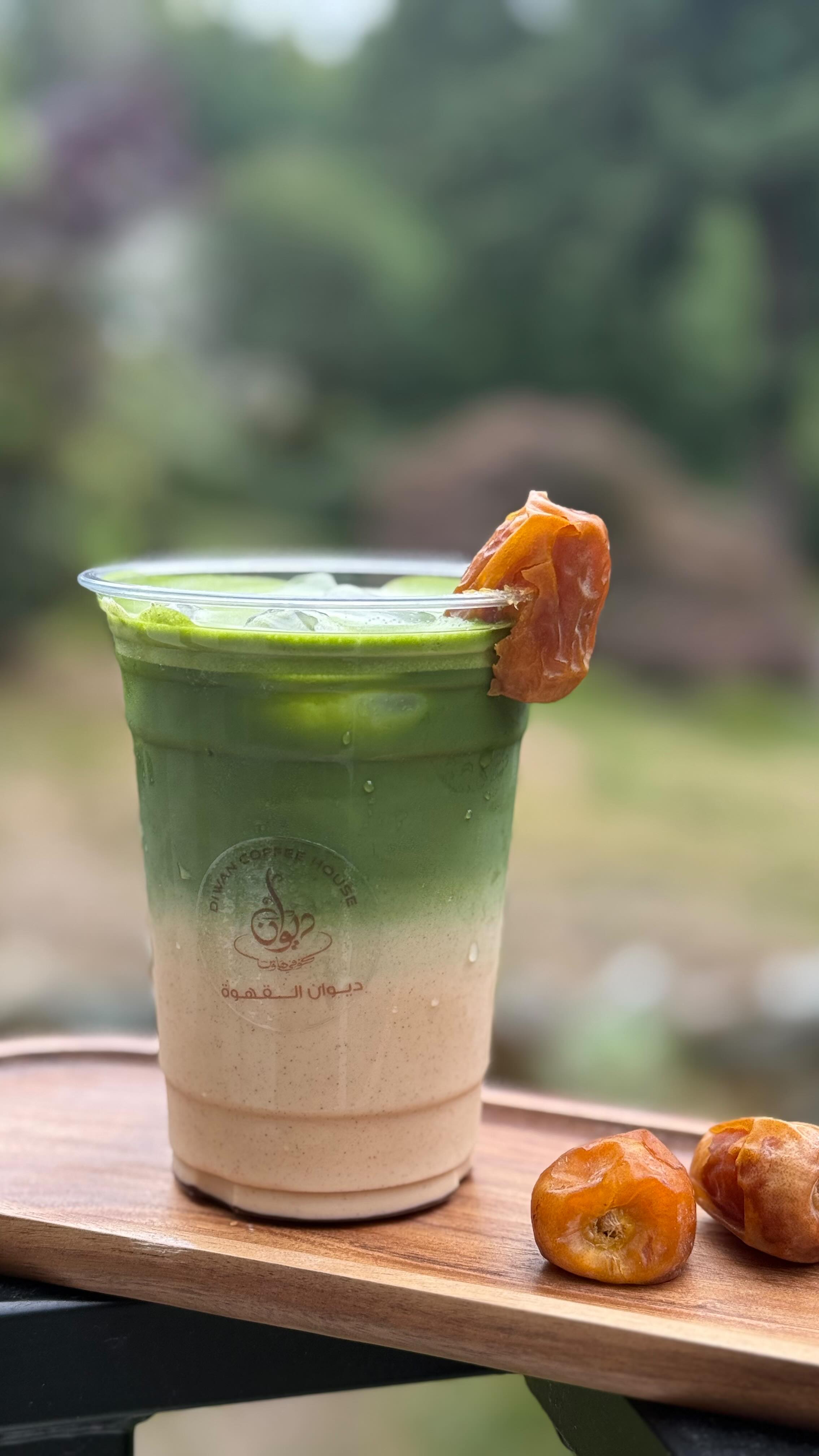 Iced date matcha latte with fresh date garnish